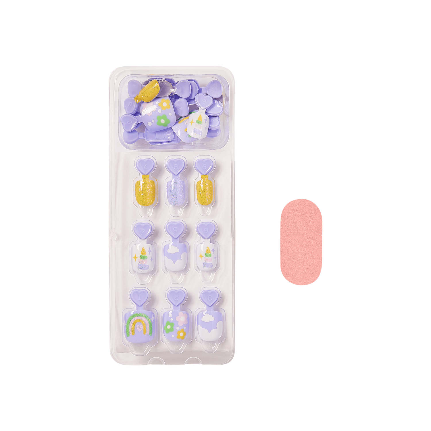 The image features a set of decorative press-on nails arranged in a clear plastic tray. The nails are predominantly in shades of purple and include various designs, such as rainbows, flowers, and glitter accents. There are also a few solid-colored nails, with one being a soft pink color placed next to the tray. The overall aesthetic is playful and colorful, suitable for a fun and trendy nail look.