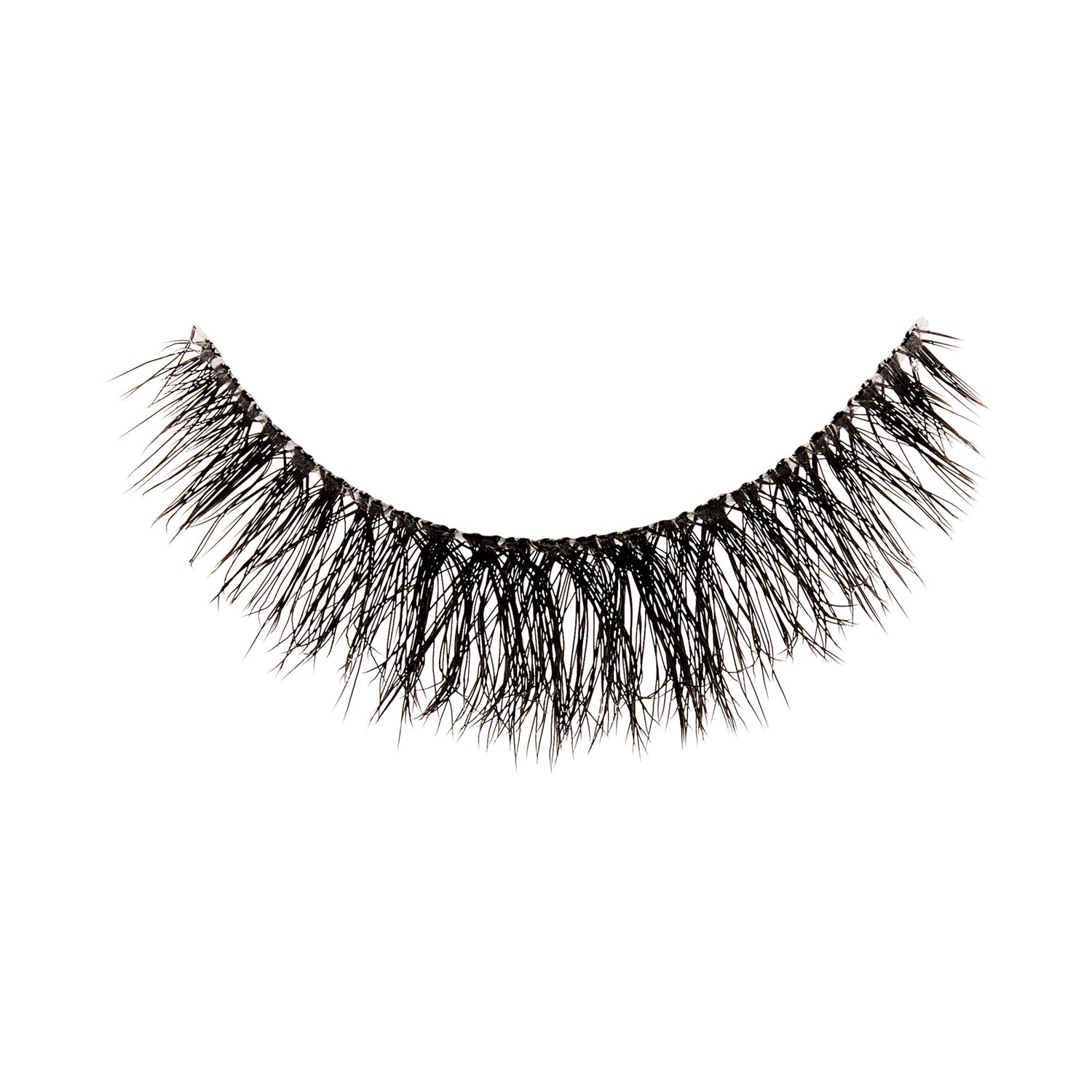 The image shows a single false eyelash. The eyelash is black and features a dense, wispy design with varying lengths of individual lashes, creating a voluminous and natural look. The base of the eyelash strip is slightly curved to fit the natural contour of the eyelid. The lashes are arranged in a way that they appear fuller at the base and taper off towards the tips.