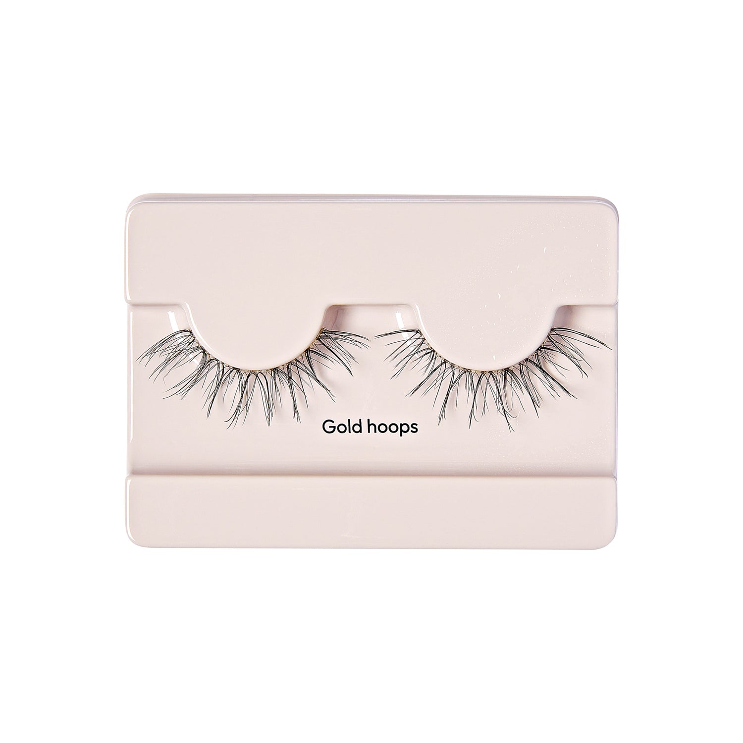 The image shows a pair of false eyelashes packaged in a light-colored rectangular case. The eyelashes are labeled "Gold hoops" and are displayed in a way that they are curved to mimic the natural shape of eyelashes. The packaging is simple and minimalistic, with the eyelashes being the main focus.