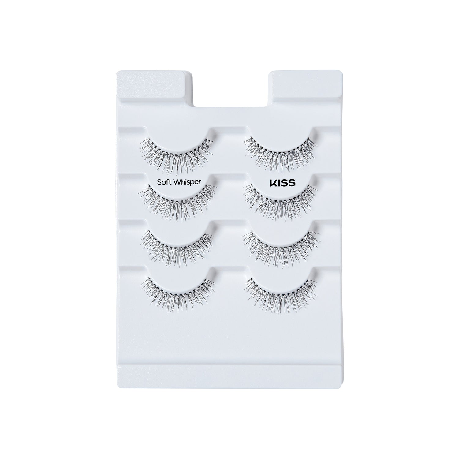 The image features a display of false eyelashes arranged on a white tray. There are four pairs of lashes, each labeled with the name "Soft Whisper" and the brand "KISS." The lashes vary in style, showcasing different lengths and thicknesses, designed to enhance the appearance of natural eyelashes. The overall presentation is clean and organized, emphasizing the product&