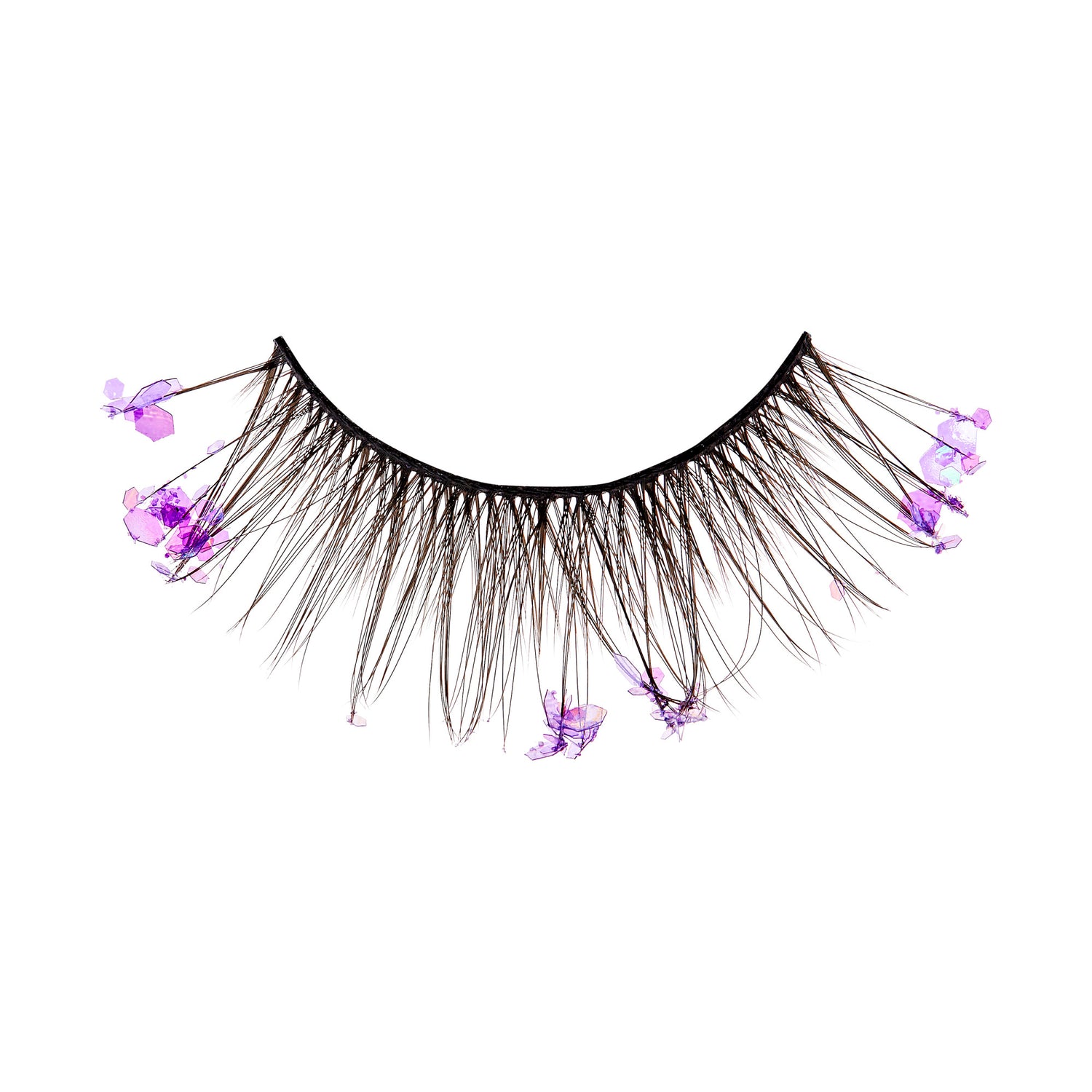 The image shows a single false eyelash strip. The eyelash strip is black and features long, wispy lashes. Attached to the lashes are small, delicate purple flowers, adding a decorative and whimsical touch to the otherwise standard false eyelash design. The flowers are spaced out along the length of the lashes, creating a unique and eye-catching appearance.