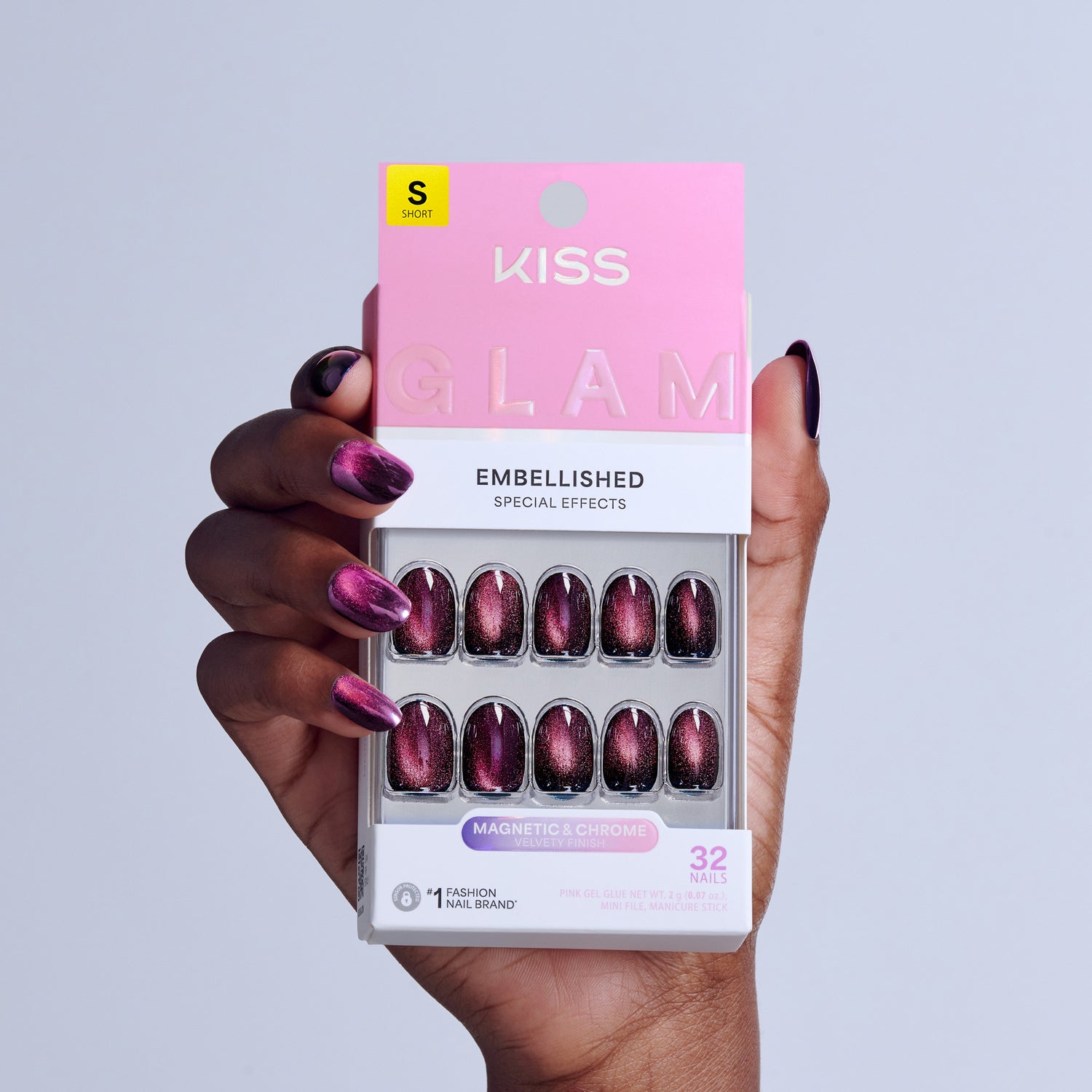 KISS Glam Embellished fake nails in magnetic chrome purple with 32 nails displayed in packaging.