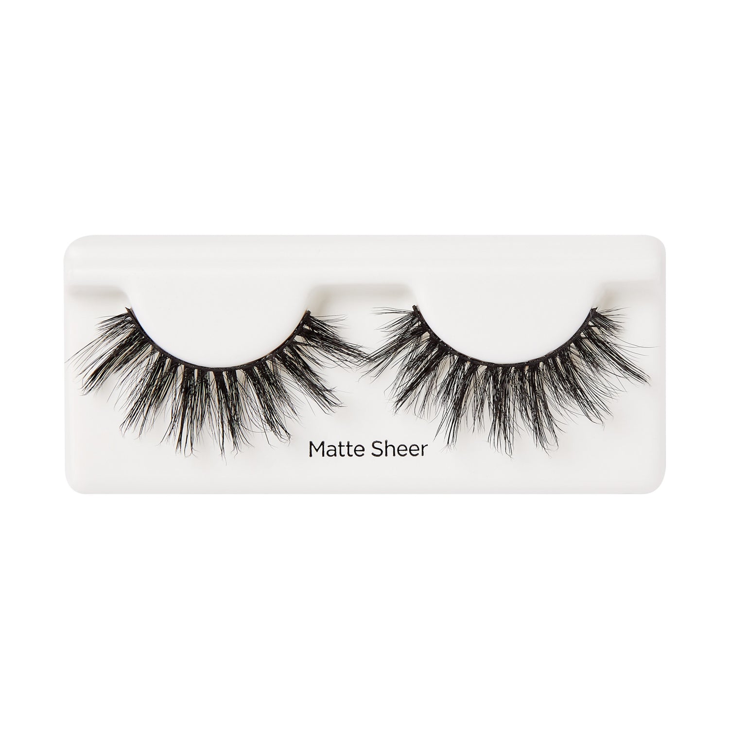 Pair of black false eyelashes with a matte finish, arranged on a white plastic tray labeled \
