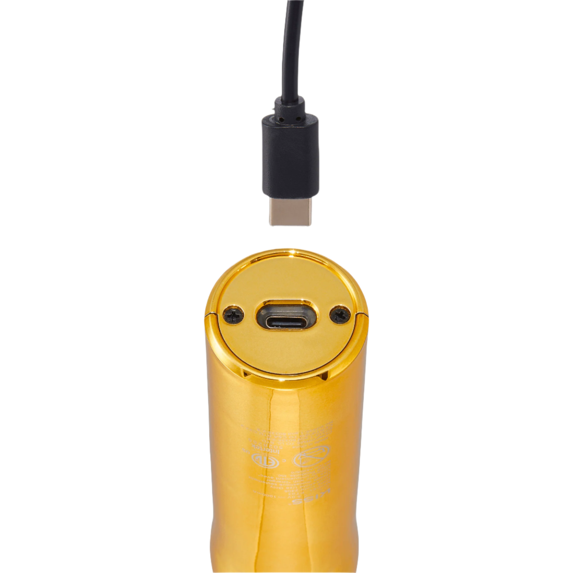 The image shows a close-up view of a gold-colored cylindrical device with a USB-C port on its top. Above the device, there is a black USB-C cable with a connector positioned as if it is about to be plugged into the port. The device has a shiny, metallic finish and appears to be a portable electronic gadget, possibly a power bank or a similar device. The USB-C port is centered on the top surface, flanked by two small screws.
