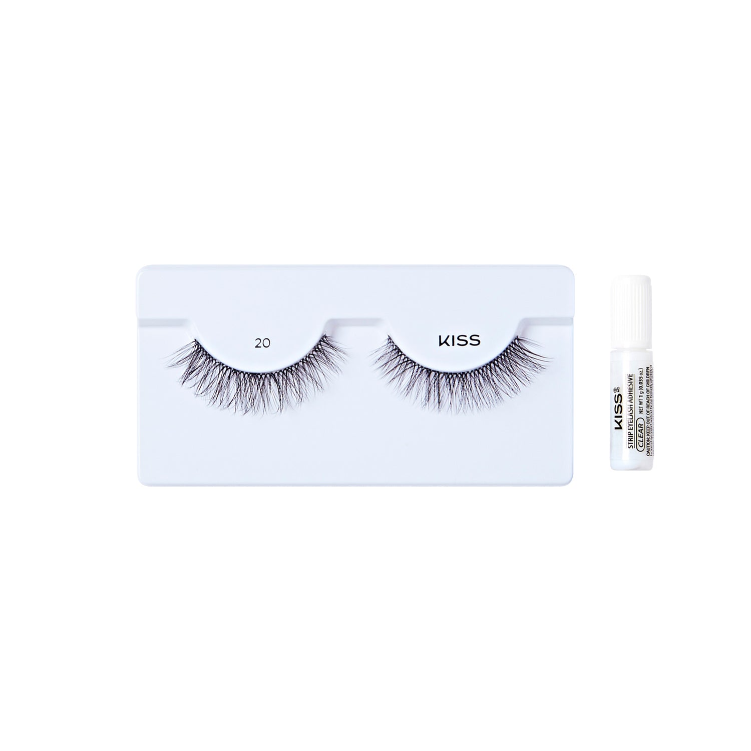 The image shows a set of false eyelashes and an adhesive glue. The false eyelashes are displayed on a white tray, with each lash labeled "20" and "KISS." The lashes are long and voluminous, designed to enhance the appearance of natural eyelashes. To the right of the tray, there is a small tube of adhesive glue, which is used to apply the false eyelashes. The glue tube is white with black text on it. The overall presentation is clean and minimalistic.