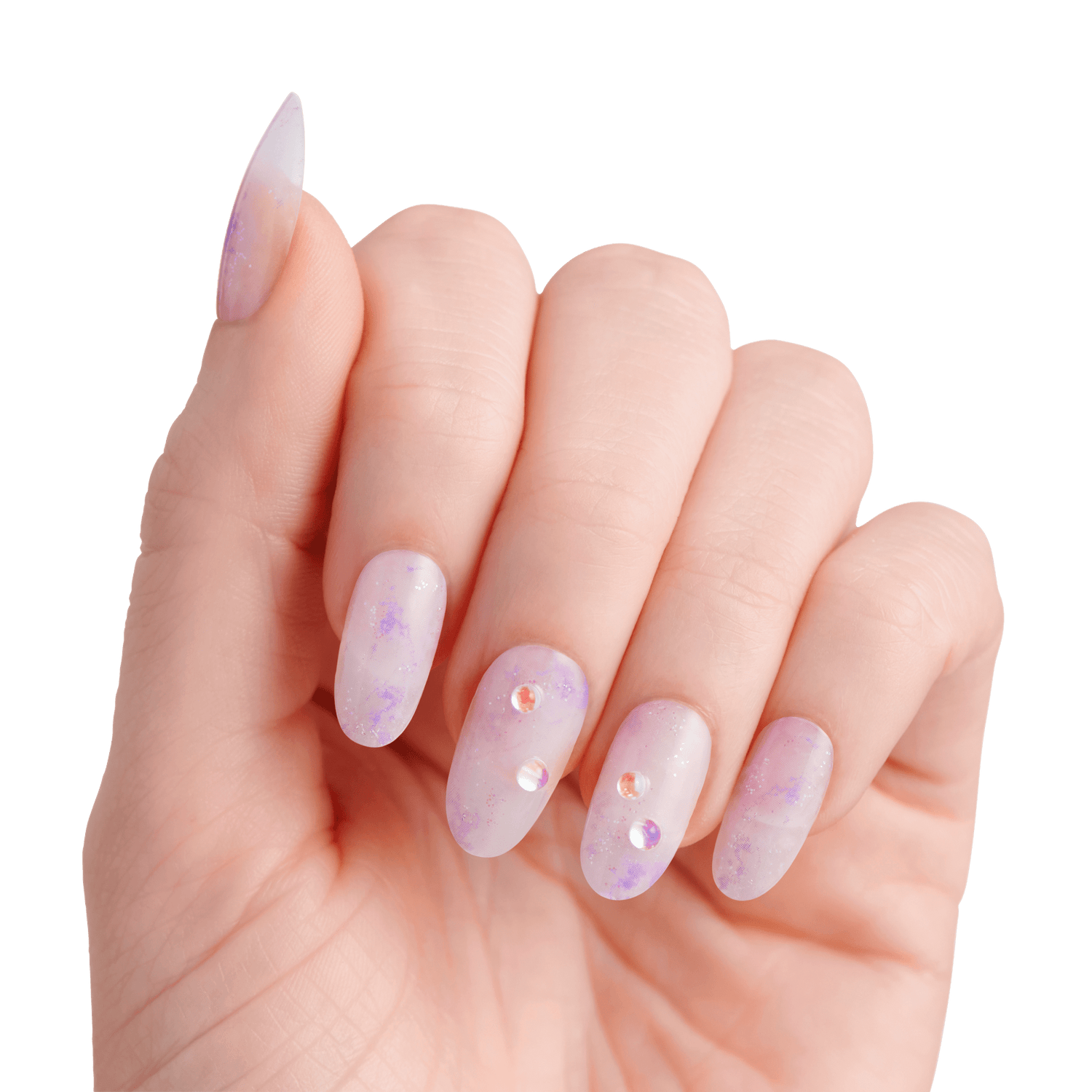 The image features a hand displaying elegantly manicured nails. The nails are long and shaped into a pointed style, showcasing a soft, translucent lavender color with a subtle gradient effect. Some nails are adorned with small, sparkling rhinestones, adding a touch of glamour. The overall look is delicate and stylish, set against a clean white background that emphasizes the beauty of the nails.