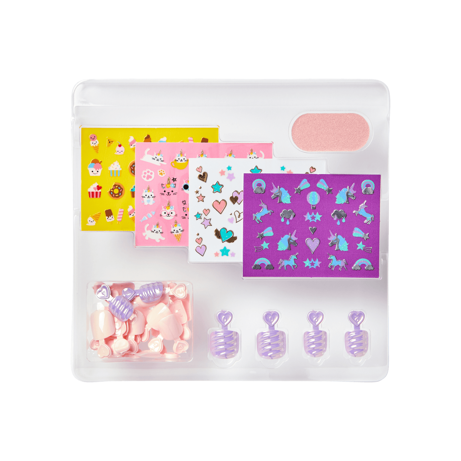 A clear plastic tray holding pink and lavender mini press-on nails, four sheets of colorful nail art stickers with cupcakes, cats, hearts, and unicorns, plus a pink nail file.