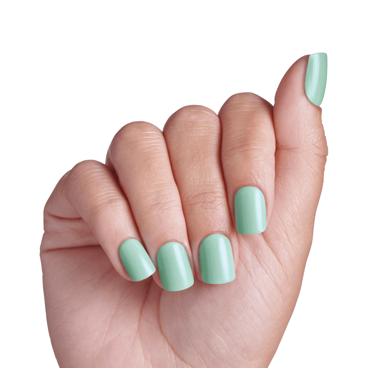Hand displaying mint green nail polish on short, rounded nails against white background.