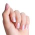 Hand showing five frosty pink press-on nails with matte finish, each decorated with a soft pink snowflake design.