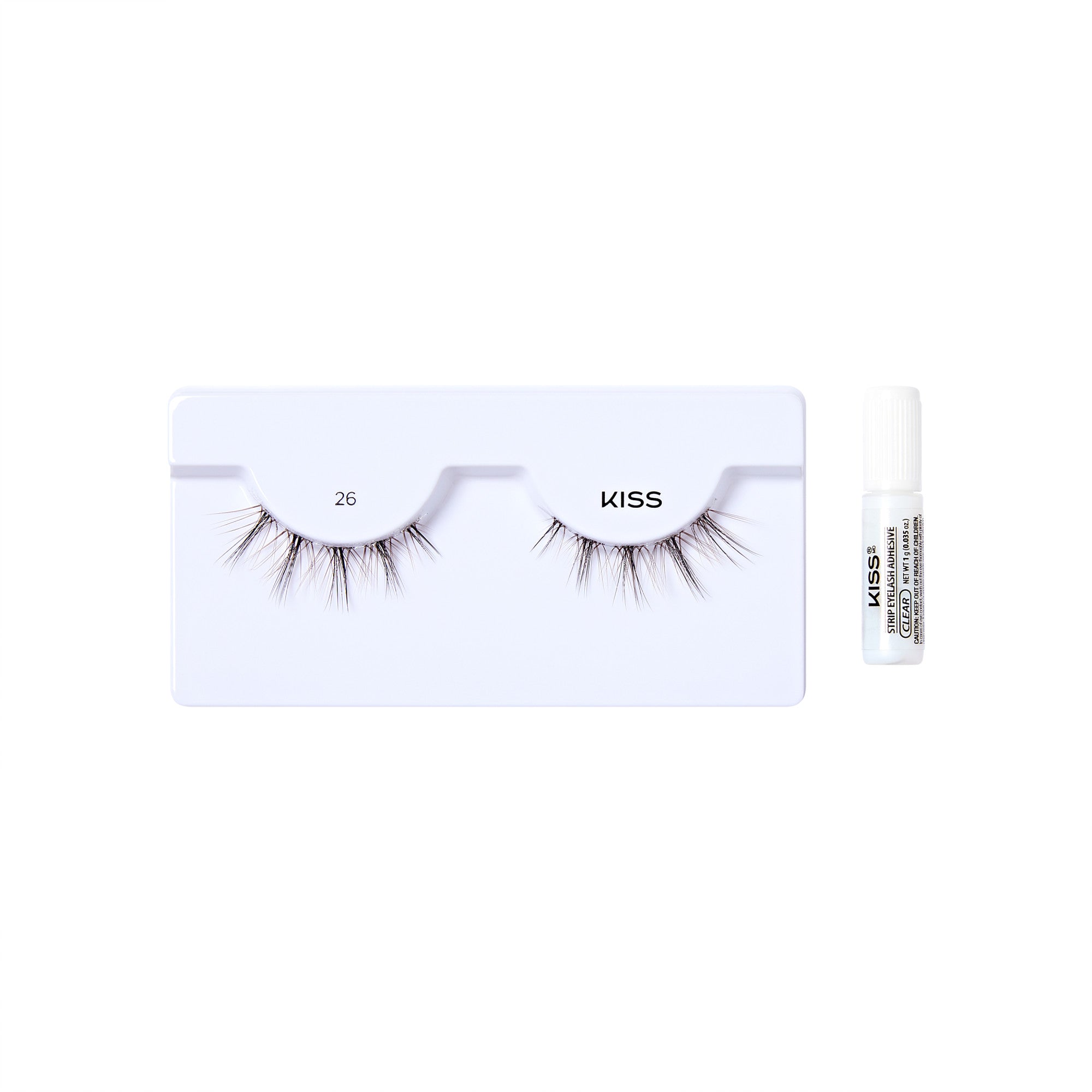 The image shows a set of false eyelashes from the brand "KISS." The eyelashes are displayed on a white tray with two sections, each holding one eyelash. The tray is labeled with the number "26" on the left side and the brand name "KISS" on the right side. To the right of the tray, there is a small white tube of adhesive, also branded with "KISS" and some additional text. The overall presentation is clean and minimalistic, highlighting the product.