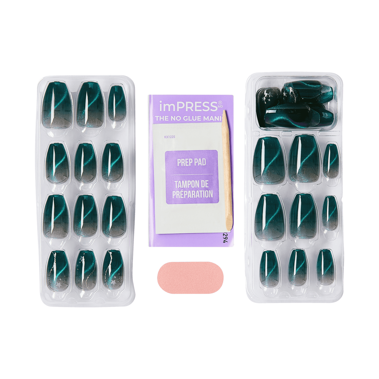 Two trays of press-on nails with a dark teal to black ombré design and silver star accents, accompanied by a purple prep pad packet and a wooden cuticle stick.
