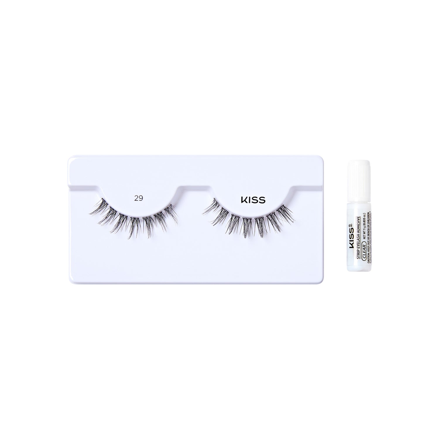 The image shows a set of false eyelashes and an adhesive glue. The false eyelashes are displayed on a white plastic tray, with the number "29" printed on the left side and the brand name "KISS" on the right side. The eyelashes are arranged in a natural, wispy style. To the right of the tray, there is a small white tube of adhesive glue, also branded with "KISS" and additional text indicating it is a strip lash adhesive. The overall presentation is clean and minimalistic, highlighting the product.