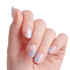 The image features a hand displaying a manicure with a gradient effect on the nails. The nails are shaped in a stylish manner, showcasing a blend of soft pastel colors, primarily pink and blue, with a shimmering finish. The overall look is elegant and modern, highlighting the delicate and well-groomed appearance of the hand. The background is plain and light, emphasizing the beauty of the nails.