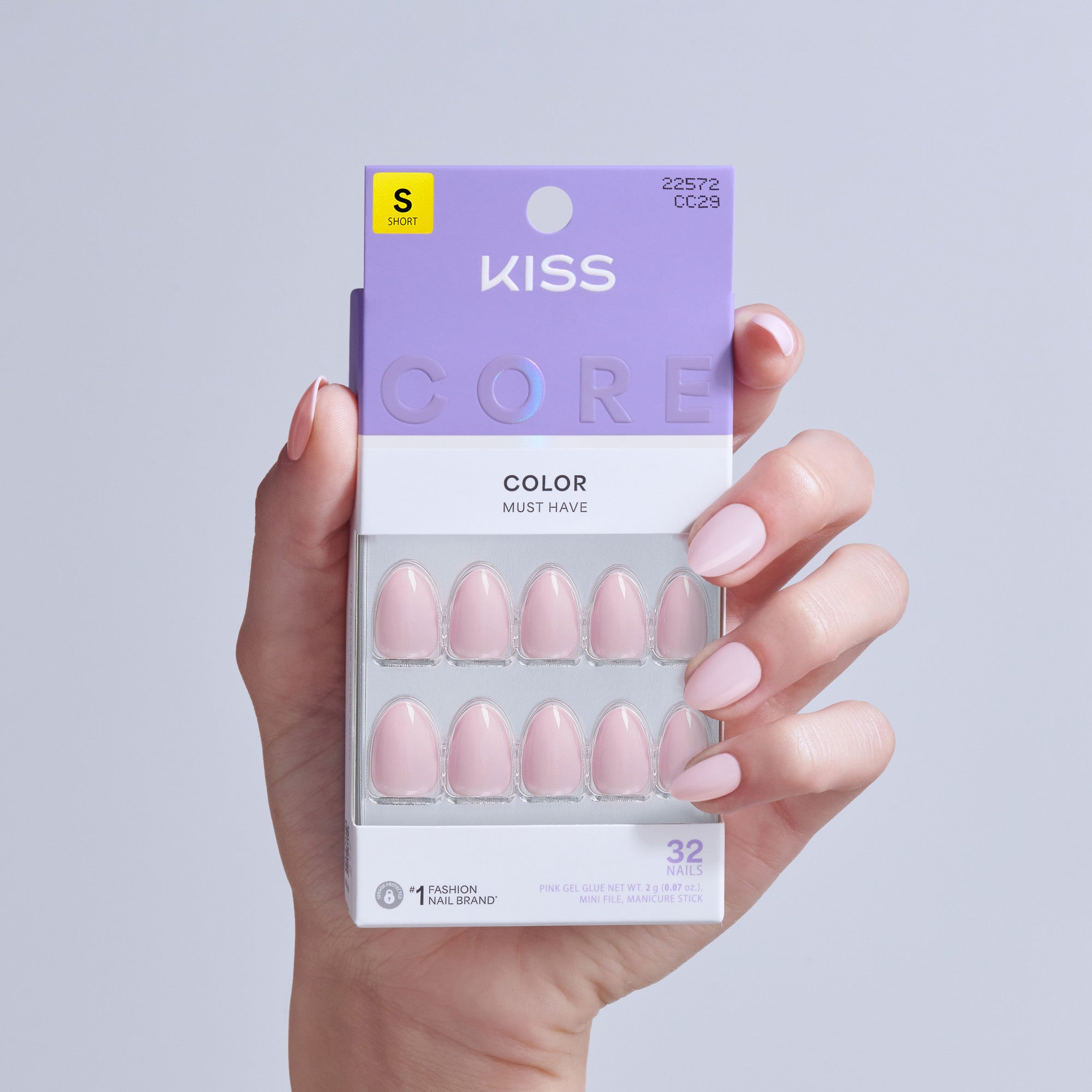 KISS Core Color Must Have pink gel nails, size short, 32 nails pack displayed in hand