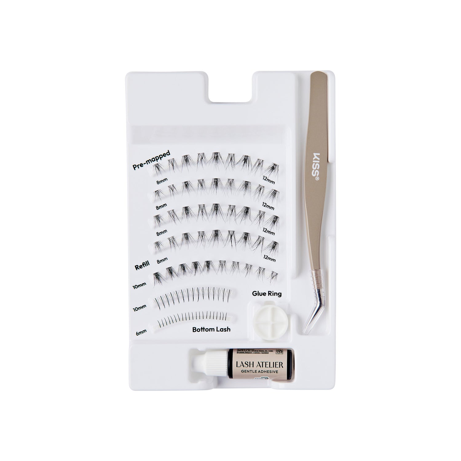 The image features a lash extension kit organized in a white tray. The kit includes various types of false eyelashes, labeled for easy identification, such as "Pre-mapped," "Refill," and "Bottom Lash." There is also a small container of adhesive glue and a glue ring for application. A pair of tweezers is included, labeled with the brand name "KISS." The overall layout is neat and designed for convenience in lash application.