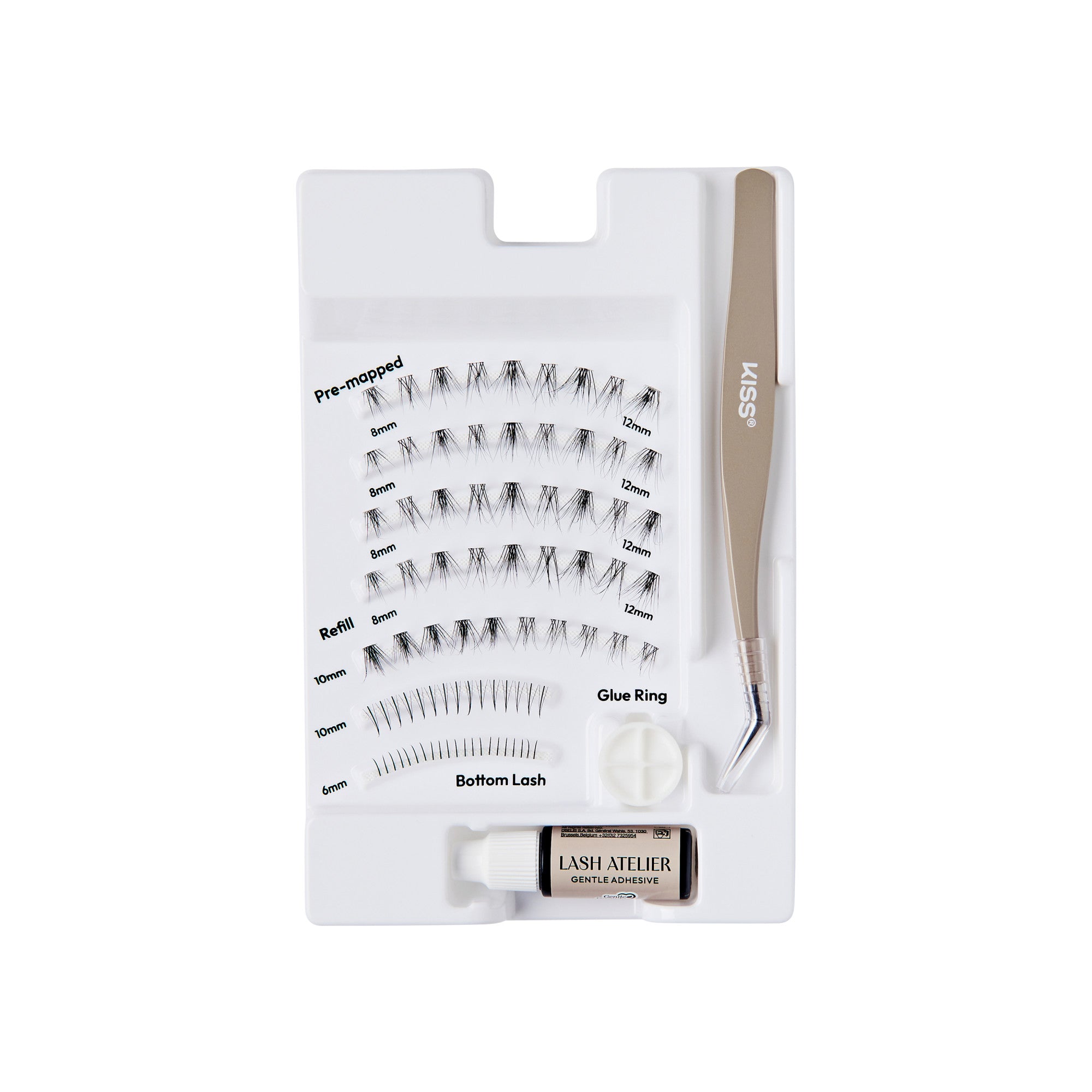 The image features a lash extension kit organized in a white tray. The kit includes various types of false eyelashes, labeled for easy identification, such as "Pre-mapped," "Refill," and "Bottom Lash." There is also a small container of adhesive glue and a glue ring for application. A pair of tweezers is included, labeled with the brand name "KISS." The overall layout is neat and designed for convenience in lash application.