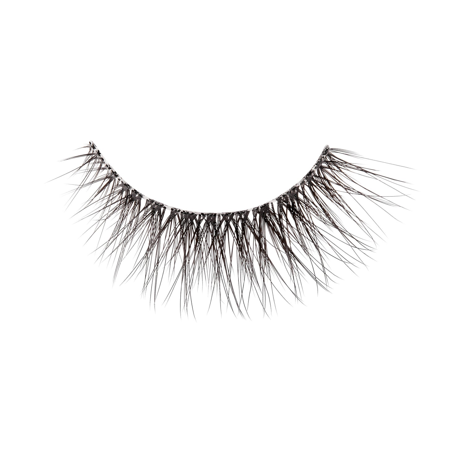 The image shows a single false eyelash. The eyelash is curved and features a dense arrangement of fine, black synthetic fibers that taper to a point, mimicking the appearance of natural eyelashes. The base of the eyelash is thicker and darker, designed to adhere to the eyelid. The fibers are arranged in a way that provides a voluminous and dramatic look. The background of the image is plain white, highlighting the details of the eyelash.