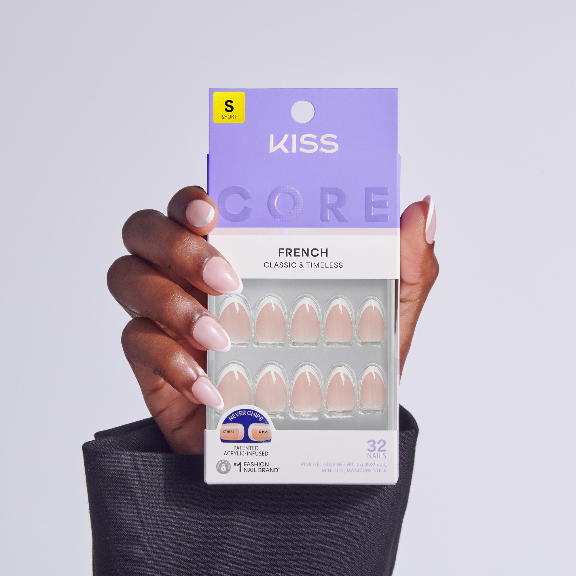 KISS Core French Classic &amp; Timeless artificial nails in size short displayed on hand.