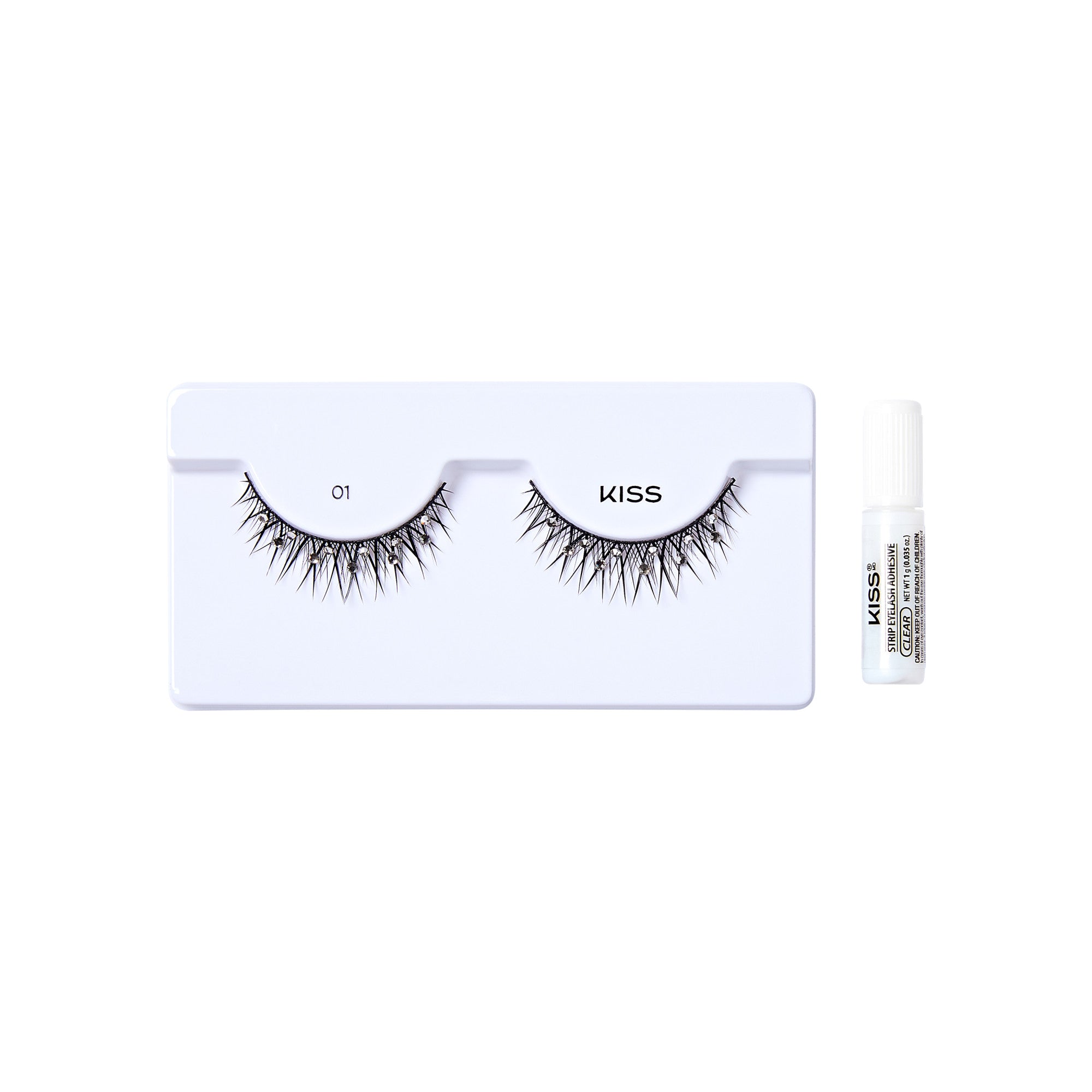 The image shows a set of false eyelashes from the brand "KISS." The eyelashes are displayed on a white tray, with each lash labeled "01." The tray is designed to hold the lashes in a curved shape, mimicking the natural curve of the eyelid. To the right of the tray, there is a small white tube of adhesive glue, also branded with "KISS." The overall presentation is clean and minimalistic, highlighting the product&
