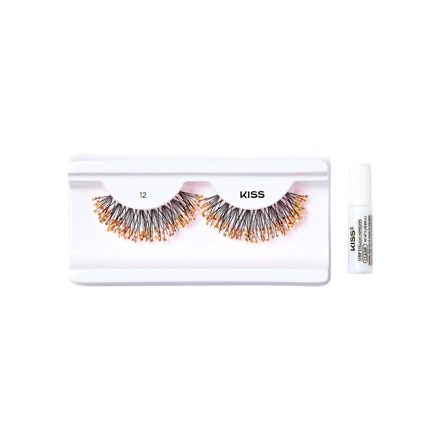 The image shows a set of false eyelashes from the brand "KISS." The eyelashes are displayed in a white plastic tray with two compartments, each holding one eyelash. The eyelashes are voluminous and appear to have a mix of black and orange colors. To the right of the tray, there is a small white tube of adhesive, also branded with "KISS," which is used to apply the eyelashes. The tray and adhesive are placed on a plain white background.