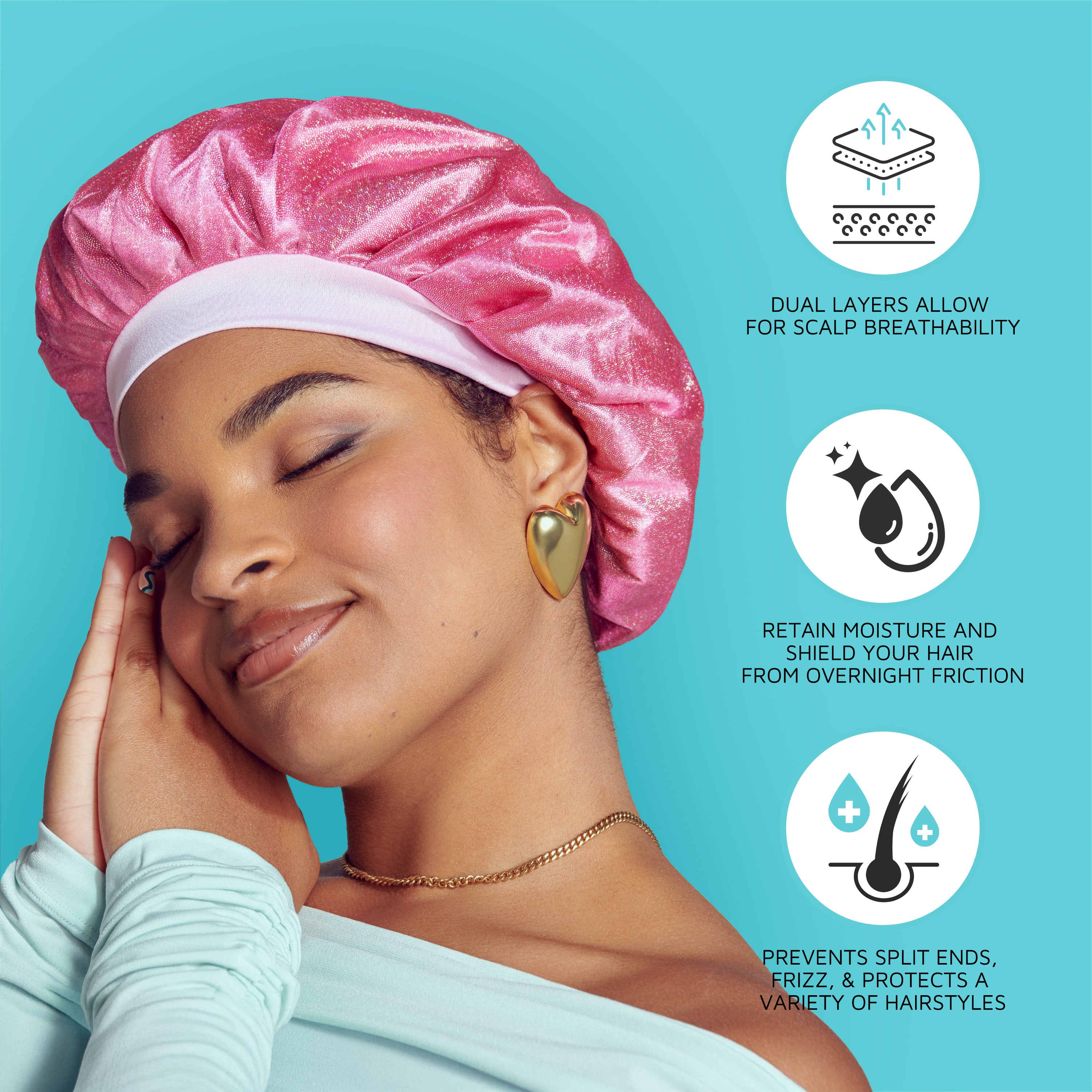 Woman with closed eyes wearing a shiny pink satin bonnet cap, gold heart earrings, and mint top on blue background. Text highlights breathability, moisture retention, and protection against split ends and frizz.