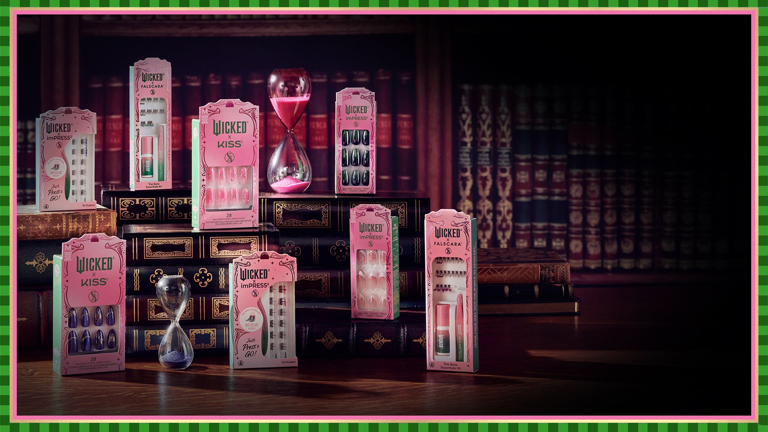 Wicked cosmetics collection featuring pink KISS nail and lash products displayed on bookshelf with hourglass.
