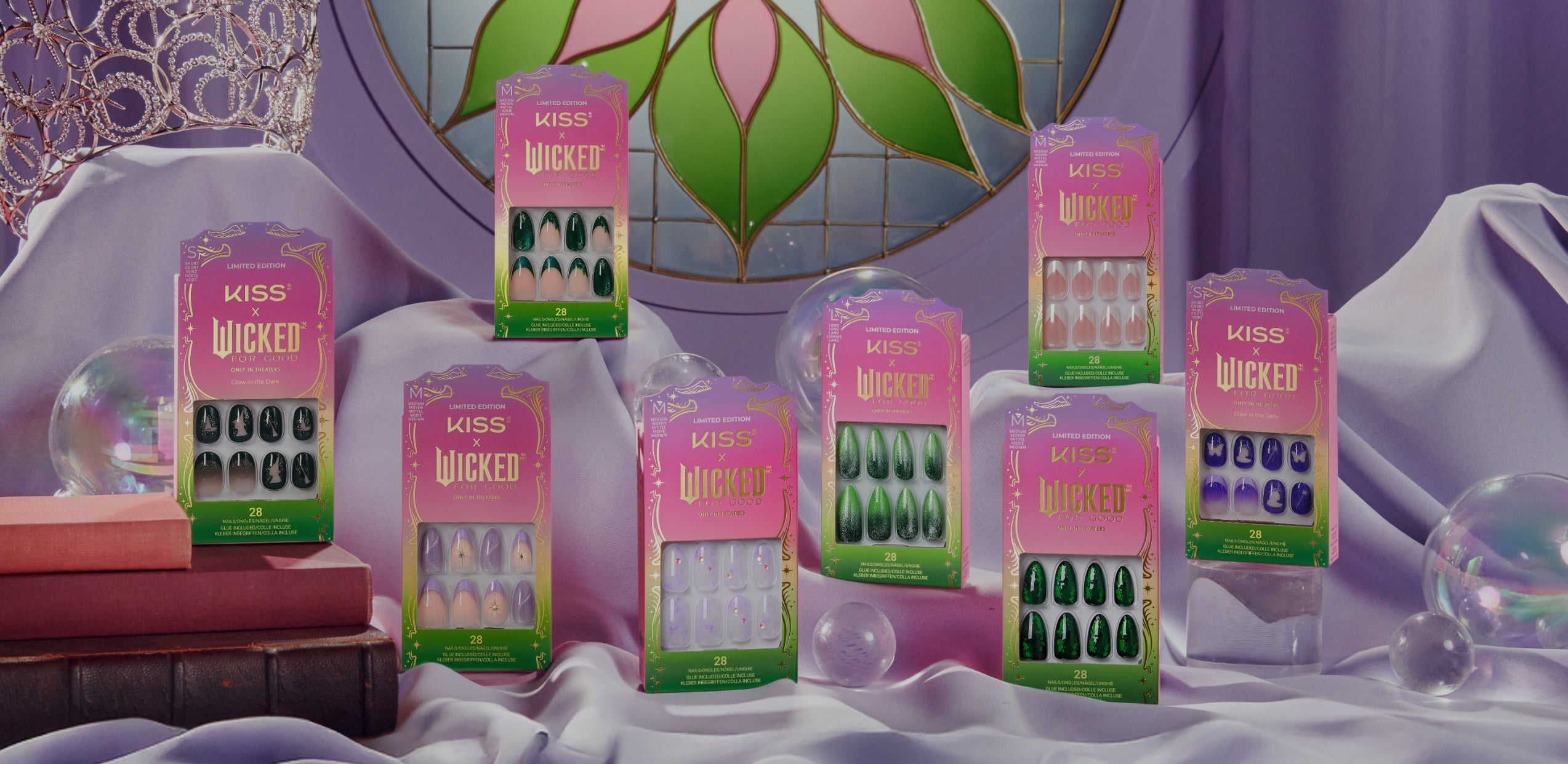 KISS x Wicked limited edition press-on nails collection displayed in pink and green packaging.