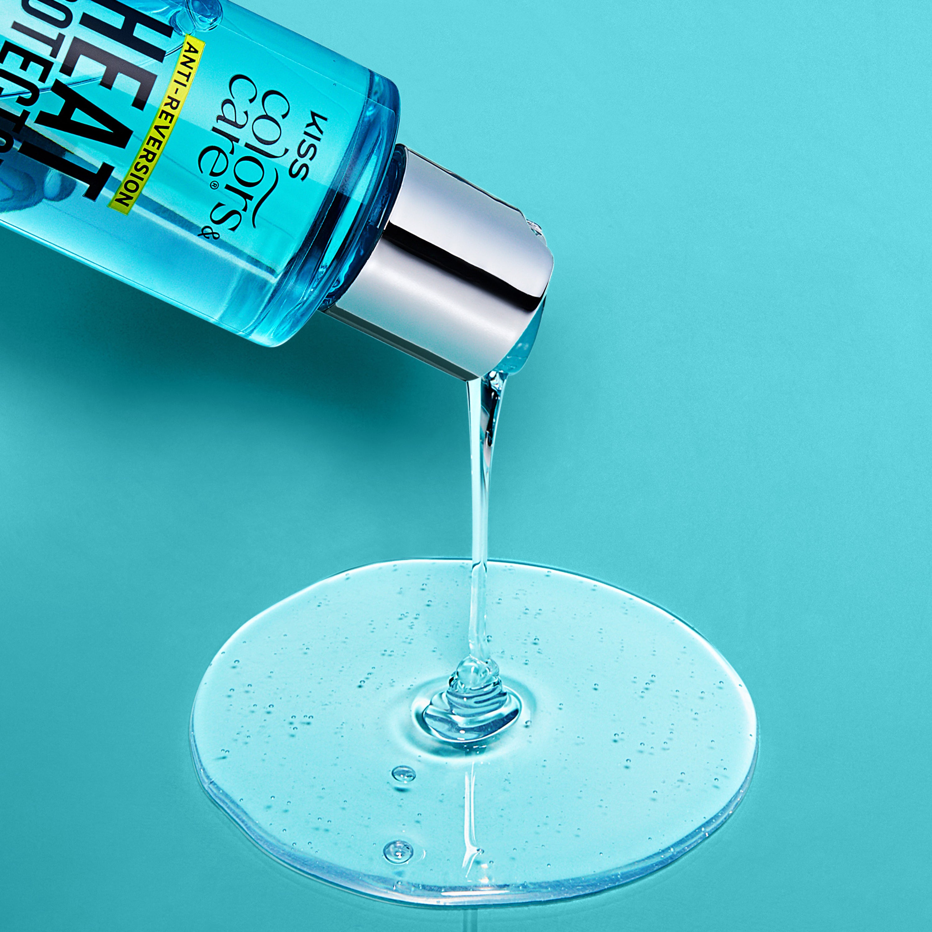 Kiss Colors &amp; Care Anti-Reversion serum pouring onto clear gel surface against turquoise background.