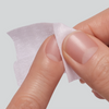 Close-up of nail being wiped with prep pad.