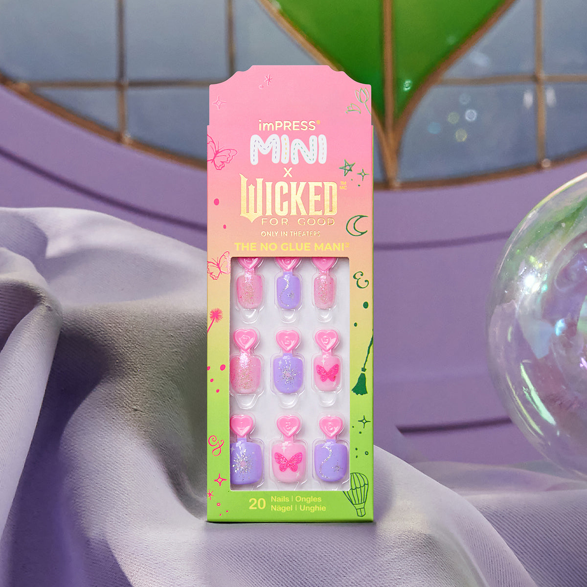 imPRESS Mini x Wicked nail set with 20 press-on nails in pink and purple.