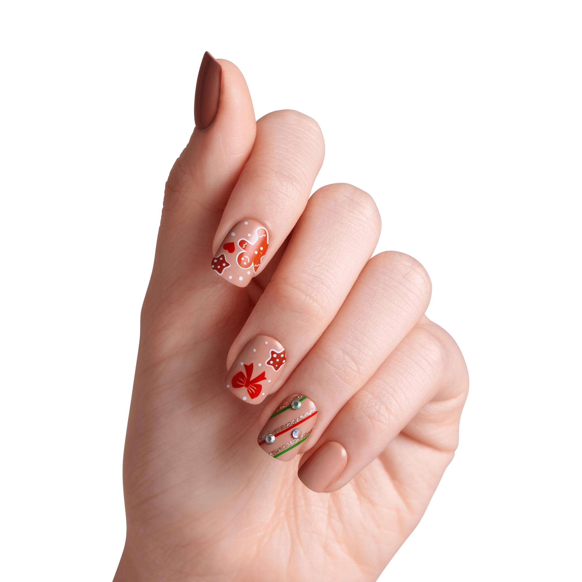 Hand displaying festive nail art with red hearts, stars, and green glitter designs on nude base.