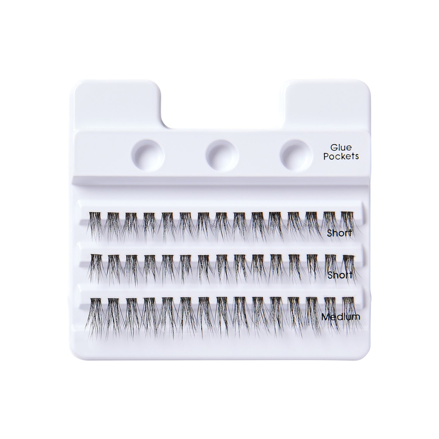 White plastic tray holding three rows of black false lash clusters labeled \