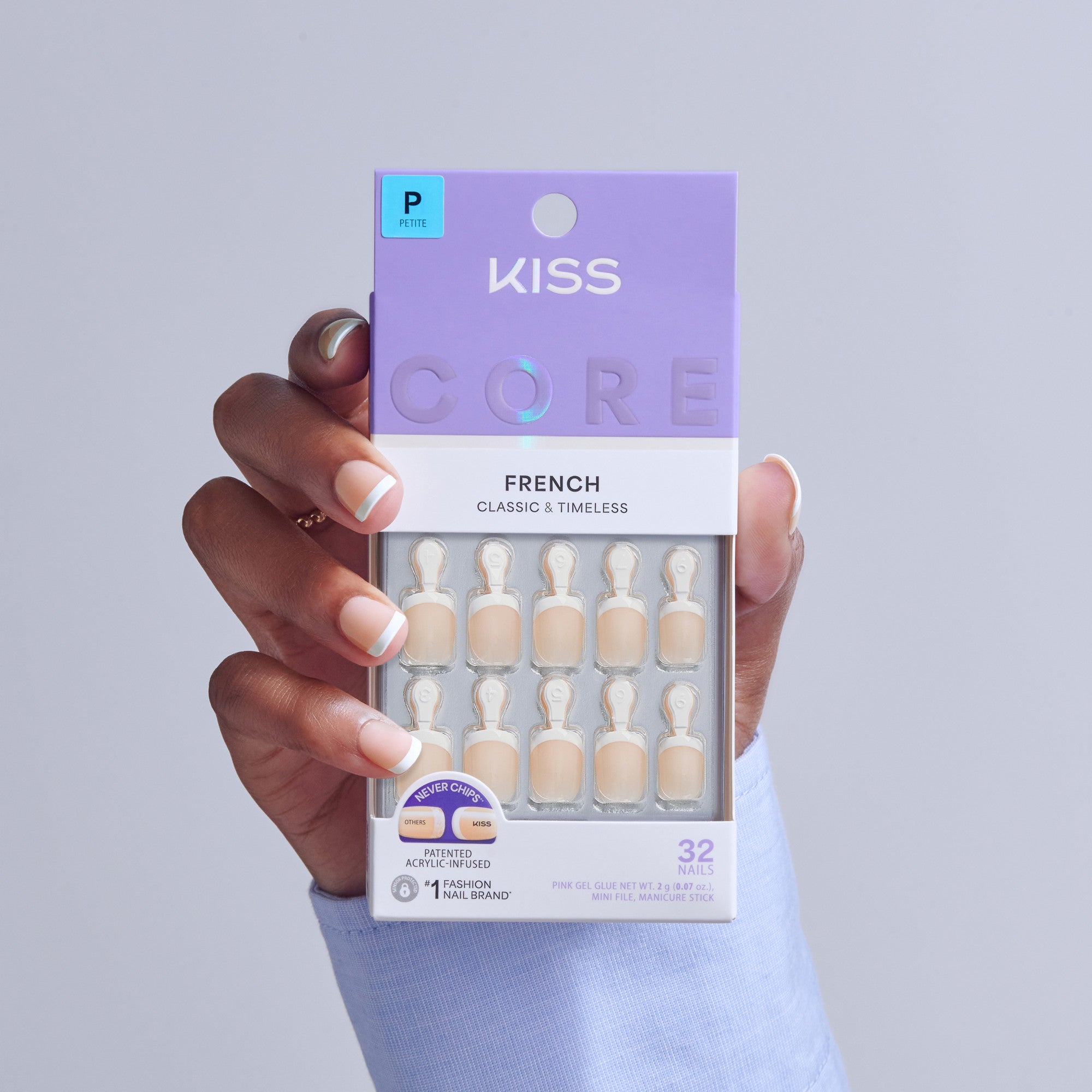 KISS Core French Classic &amp; Timeless press-on nails in Petite size, displayed in hand.