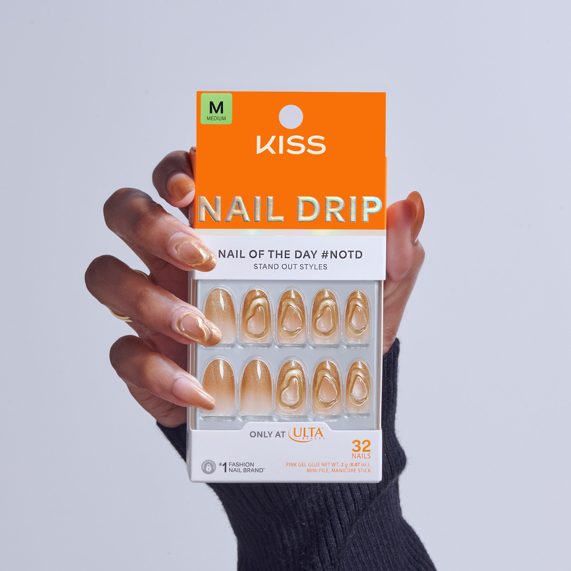 KISS Nail Drip medium press-on nails in gold with abstract designs, 32-piece set