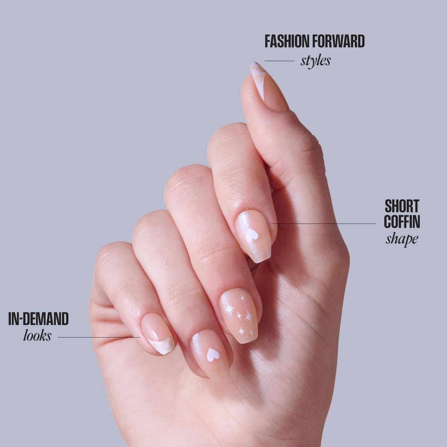 Short coffin nail design with heart and star accents on neutral base.