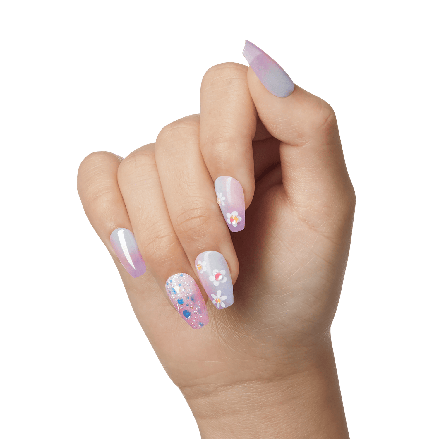 The image shows a hand with manicured nails. The nails are decorated with a variety of designs. The thumb and pinky nails have a gradient effect transitioning from a light purple to a light blue. The index and middle nails are painted in a light pink shade with small white and yellow flower designs. The ring finger nail features a clear base with colorful glitter and small flower designs. The overall look is vibrant and playful, combining pastel colors, floral patterns, and glitter.