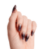 The image features a hand displaying elegantly manicured nails. The nails are long and pointed, showcasing a gradient design that transitions from a deep, dark color at the base to a lighter shade at the tips. The overall finish appears glossy, with a subtle shimmer that adds depth to the color. The hand is positioned against a plain white background, emphasizing the striking nail art.