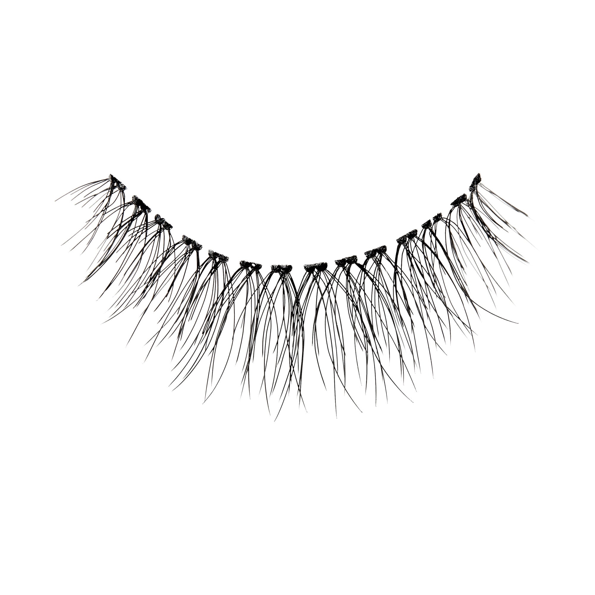 The image shows a single strip of false eyelashes. The eyelashes are black and appear to be long and wispy, with varying lengths to create a natural, voluminous look. The strip is curved to fit the natural shape of the eyelid. The lashes are densely packed at the base and taper off to finer tips.