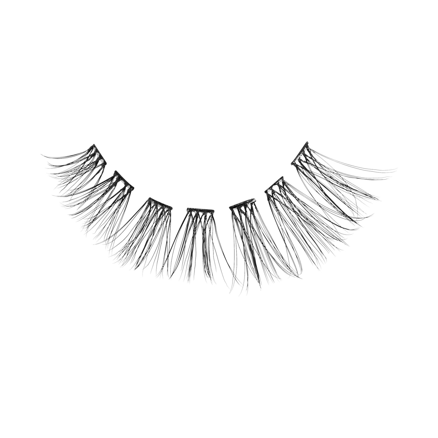 False eyelashes with layered, wispy black strands on white background.