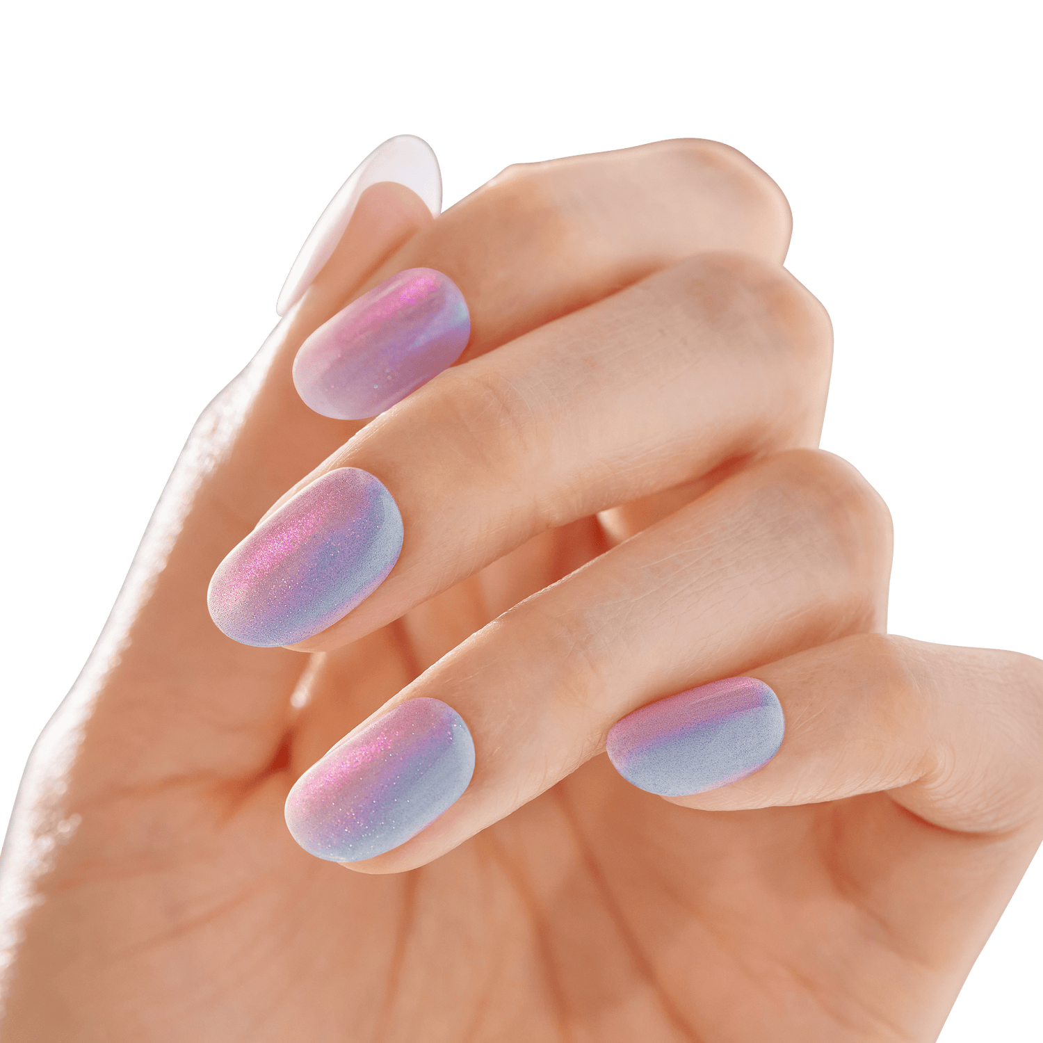The image shows a close-up of a hand with manicured nails. The nails are painted with a gradient design that transitions from a light blue at the base to a pinkish-purple hue towards the tips. The finish of the nail polish appears to be slightly shimmery, giving the nails a glossy and iridescent look. The hand is positioned with the fingers slightly bent, showcasing the nails clearly. The background is blurred and neutral, ensuring that the focus remains on the nails.