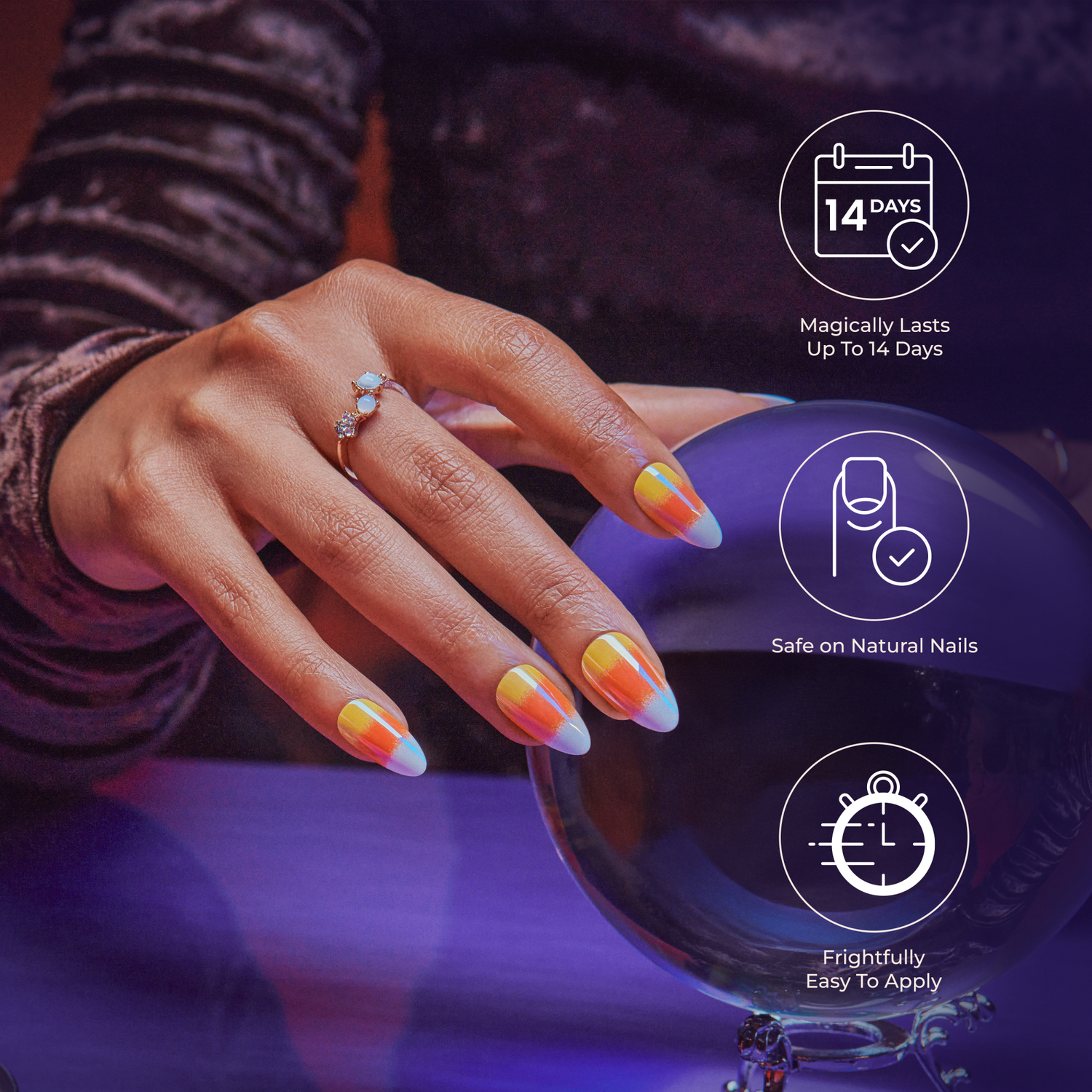 Hand with long press-on nails painted in gradient orange and white holding a purple crystal ball, with text highlighting 14-day wear, safe on natural nails, and easy application.