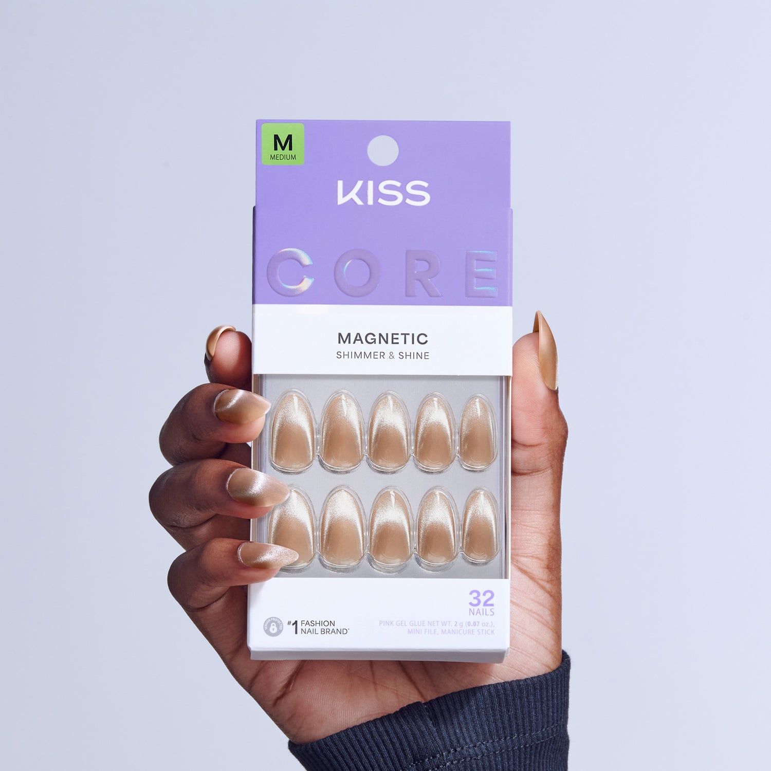 KISS Core Magnetic Medium fake nails in champagne shimmer shade, displayed in packaging.
