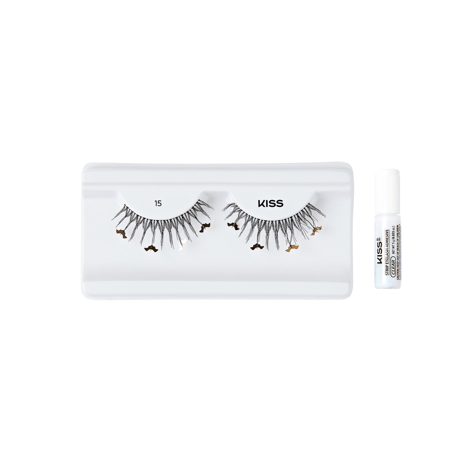 The image shows a set of false eyelashes from the brand "KISS." The eyelashes are displayed in a white plastic tray, with the number "15" printed above the left eyelash and the brand name "KISS" above the right eyelash. The eyelashes have a unique design with small decorative elements attached to them. To the right of the tray, there is a small tube of adhesive glue, also branded with "KISS" and labeled as "Strip Lash Adhesive." The overall presentation is clean and minimalistic, highlighting the product.