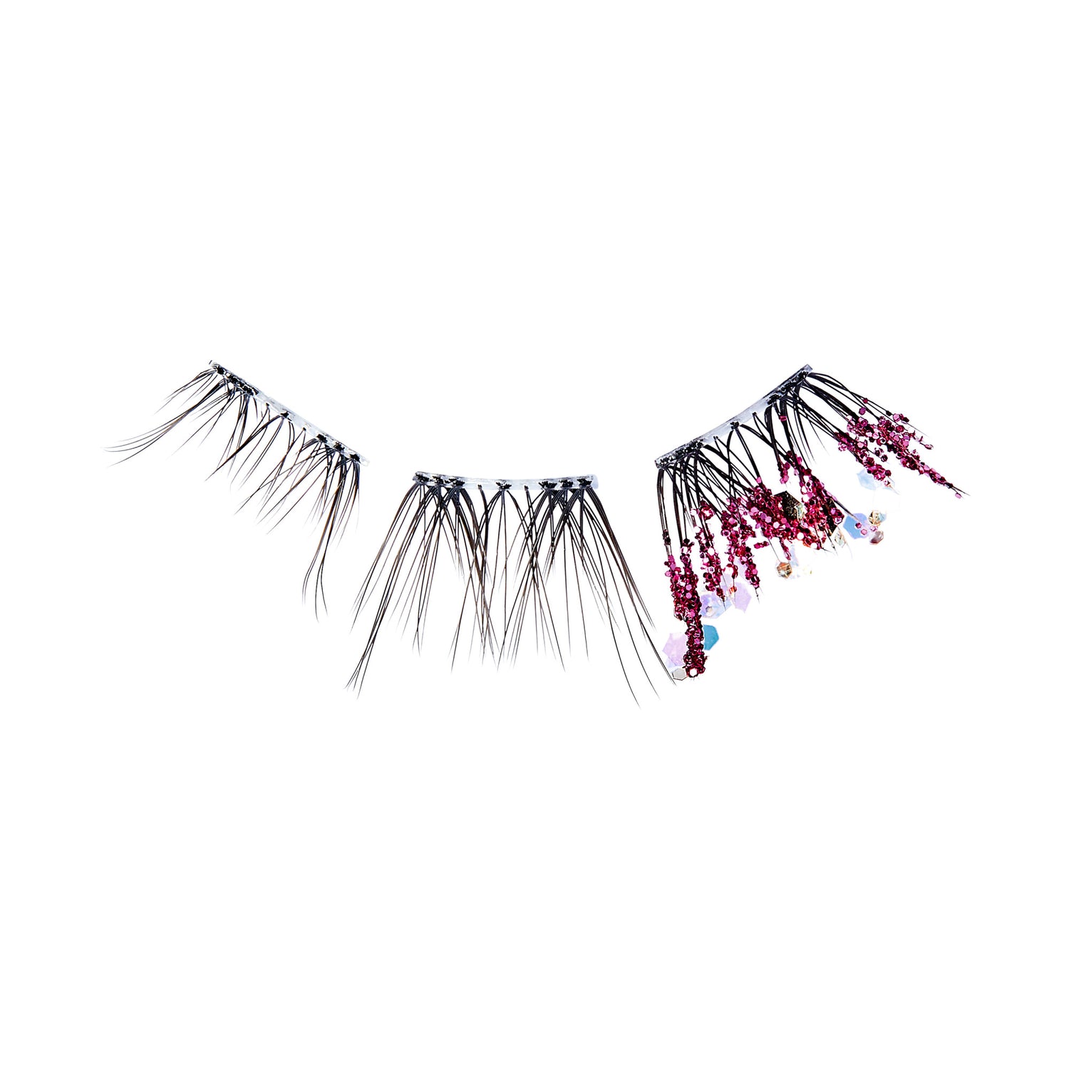 The image features a set of false eyelashes designed with a unique and artistic flair. The lashes are predominantly black, with varying lengths that create a dramatic effect. One section of the lashes is adorned with small, colorful embellishments, including tiny flowers and beads, adding a touch of whimsy and elegance. The overall look is striking and would likely be used for a bold makeup statement or a special occasion. The background is plain, emphasizing the intricate details of the lashes.
