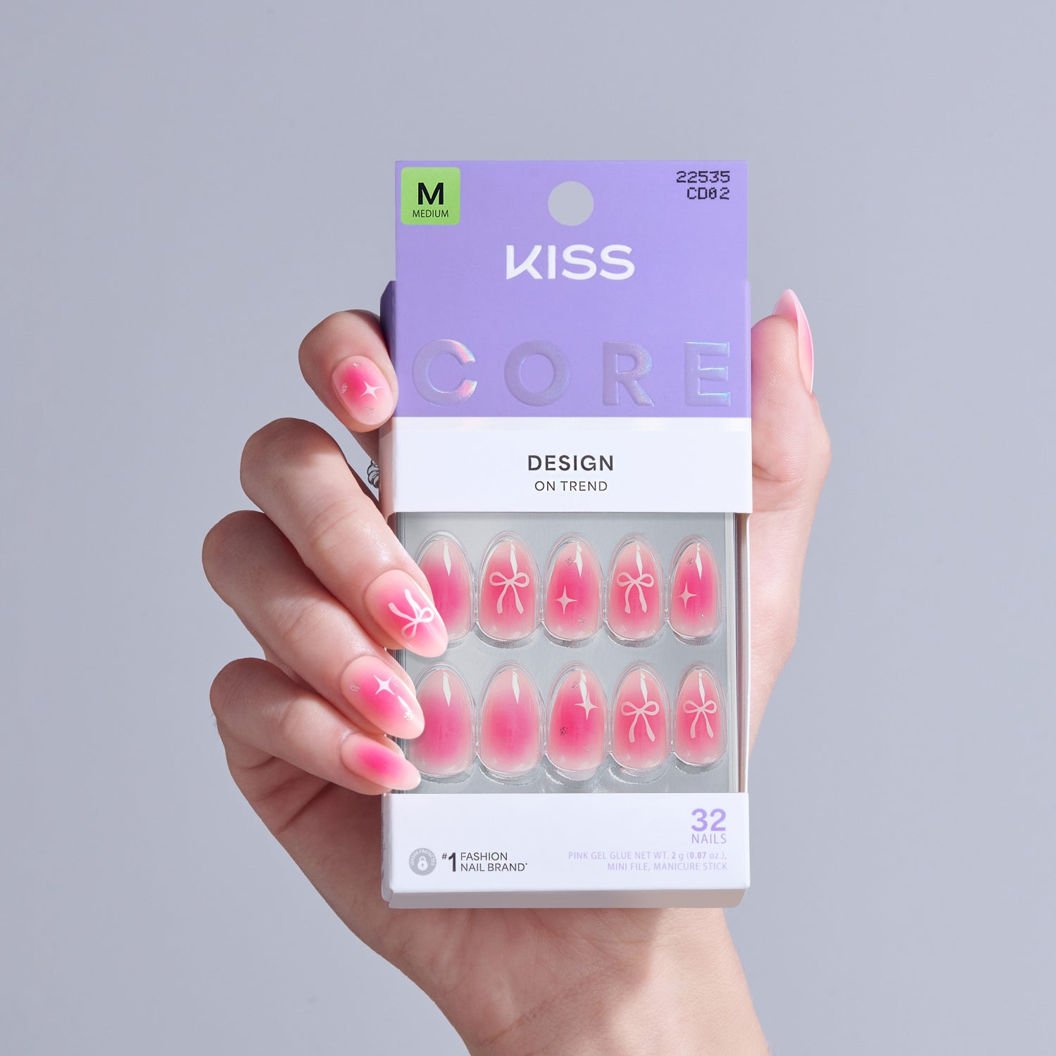 KISS Core Design On Trend press-on nails in pink with bow and star designs, size M, 32 nails.