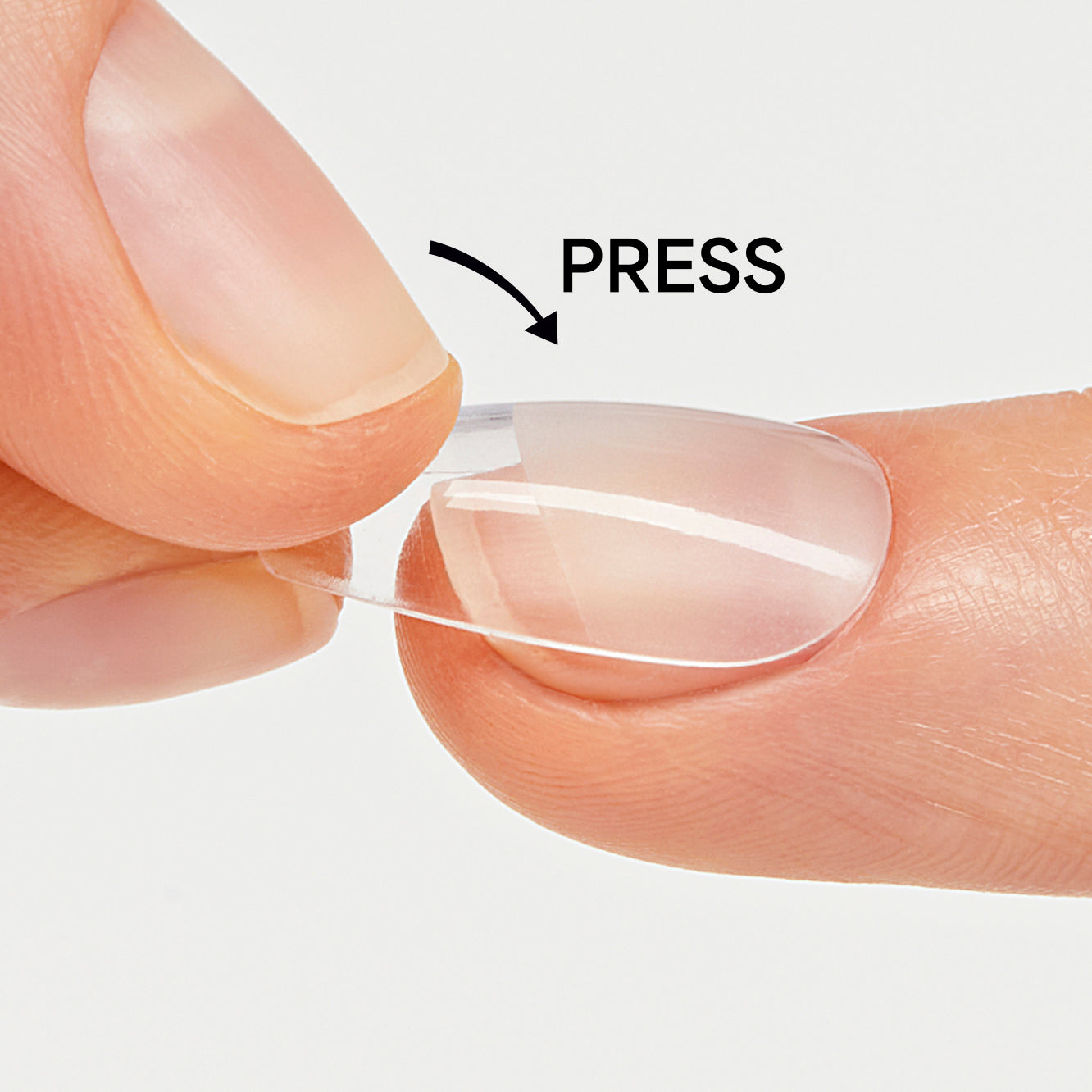 Close-up of fingers holding a contact lens with 'PRESS' text and arrow.