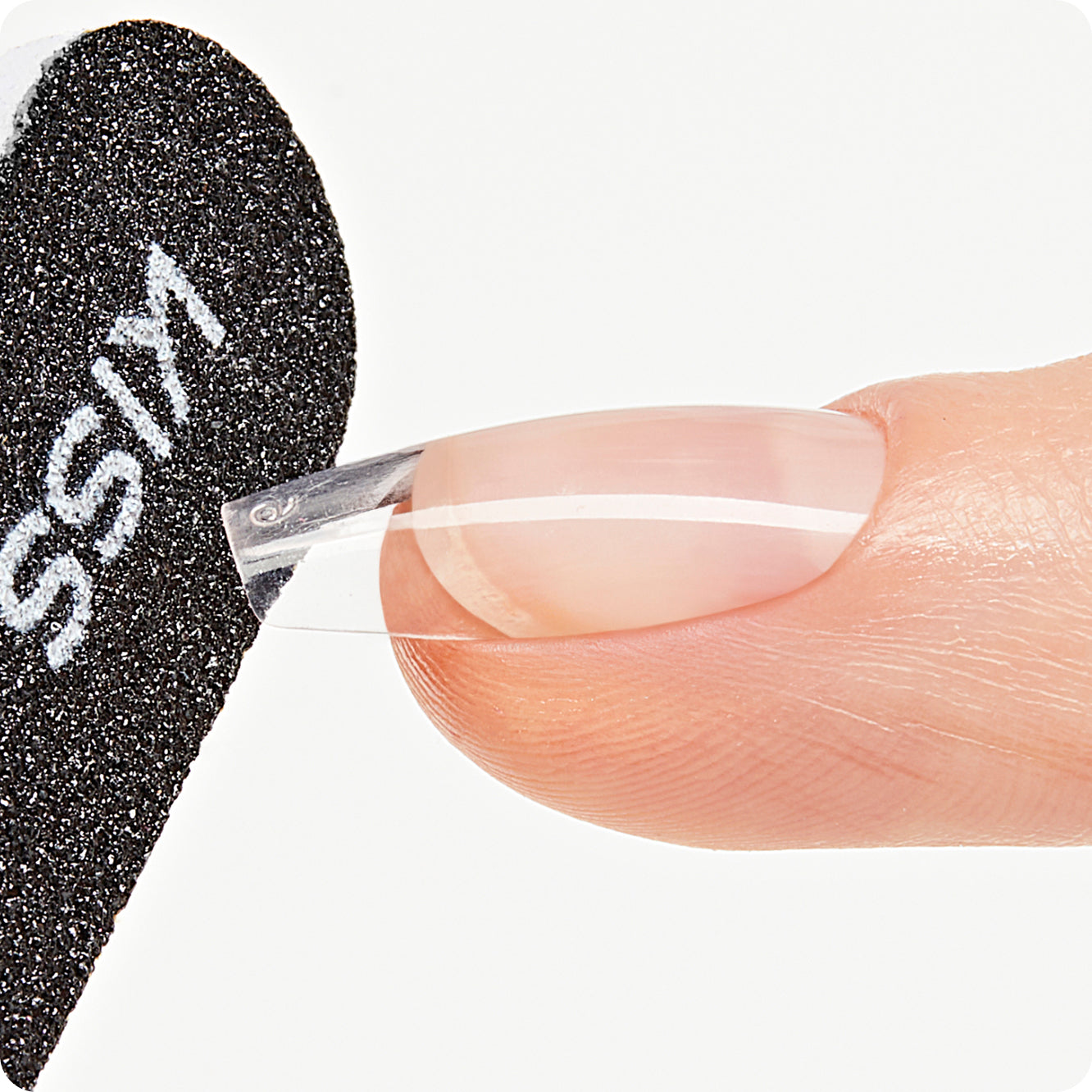 nail being filed by a black nail file