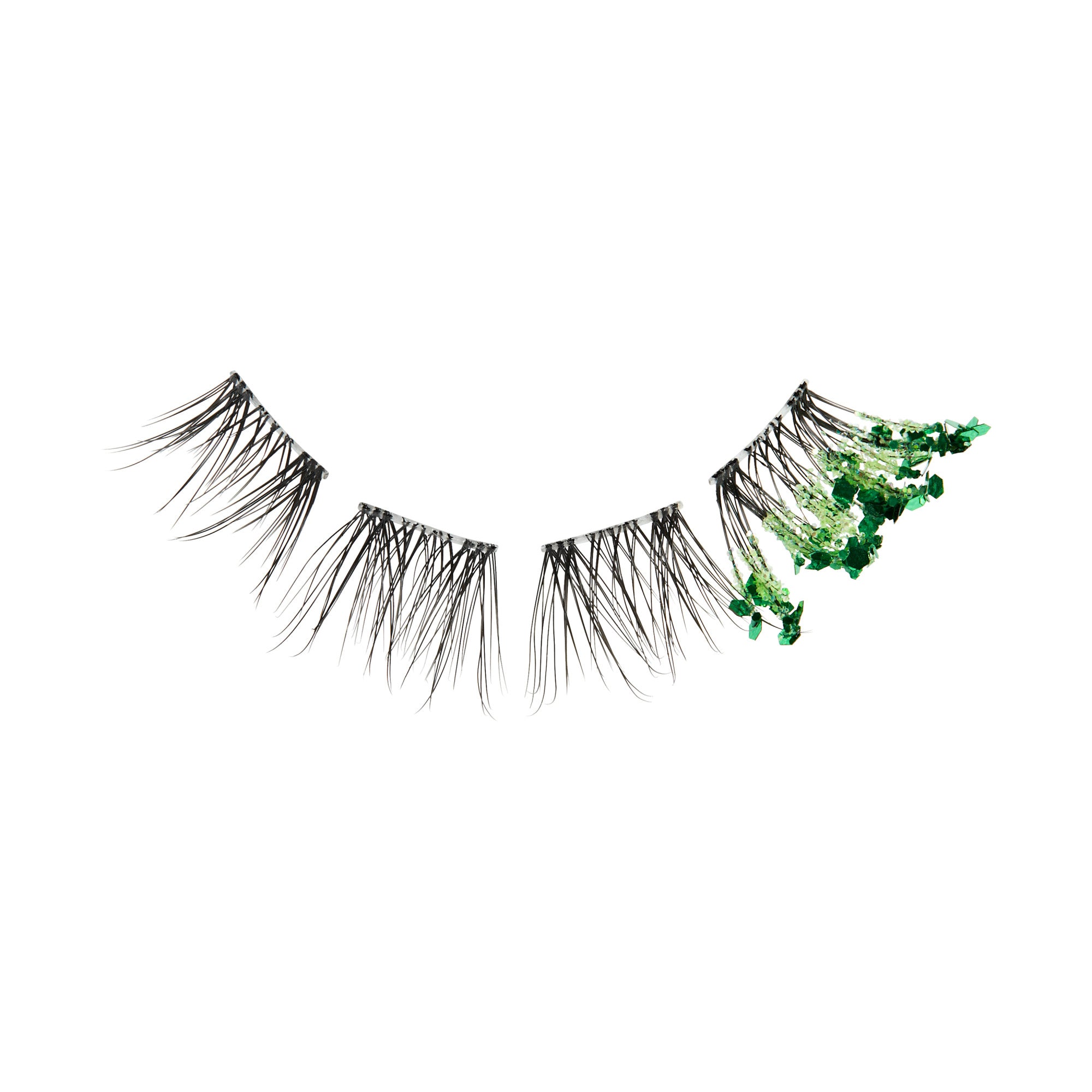 False eyelashes with green glitter embellishments on right lash.