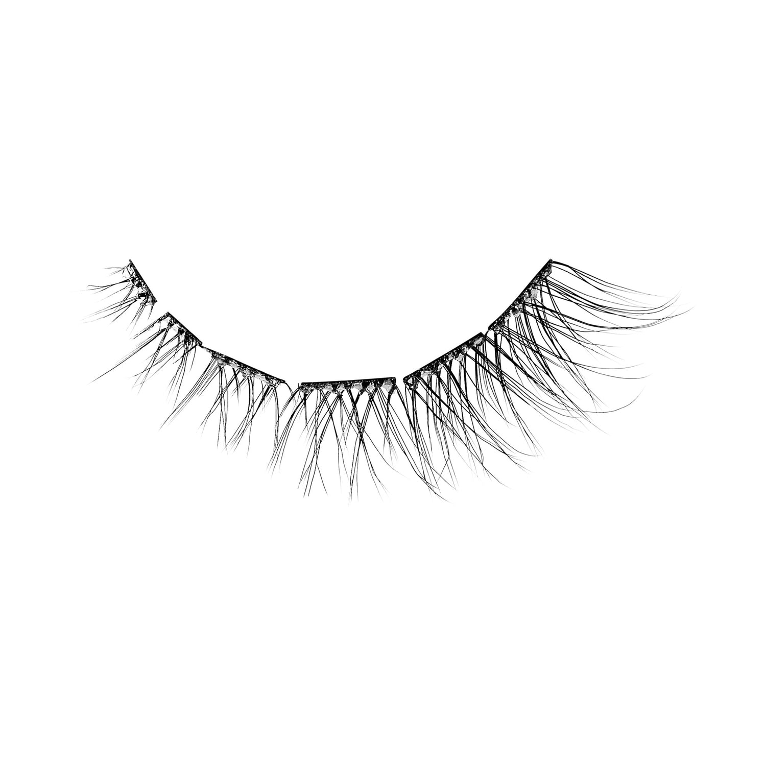 The image features a pair of false eyelashes. The lashes are long and wispy, with varying lengths that create a natural, fluttery appearance. They are arranged in a curved shape, designed to enhance the eyes by adding volume and length. The background is plain white, emphasizing the detail and texture of the lashes.