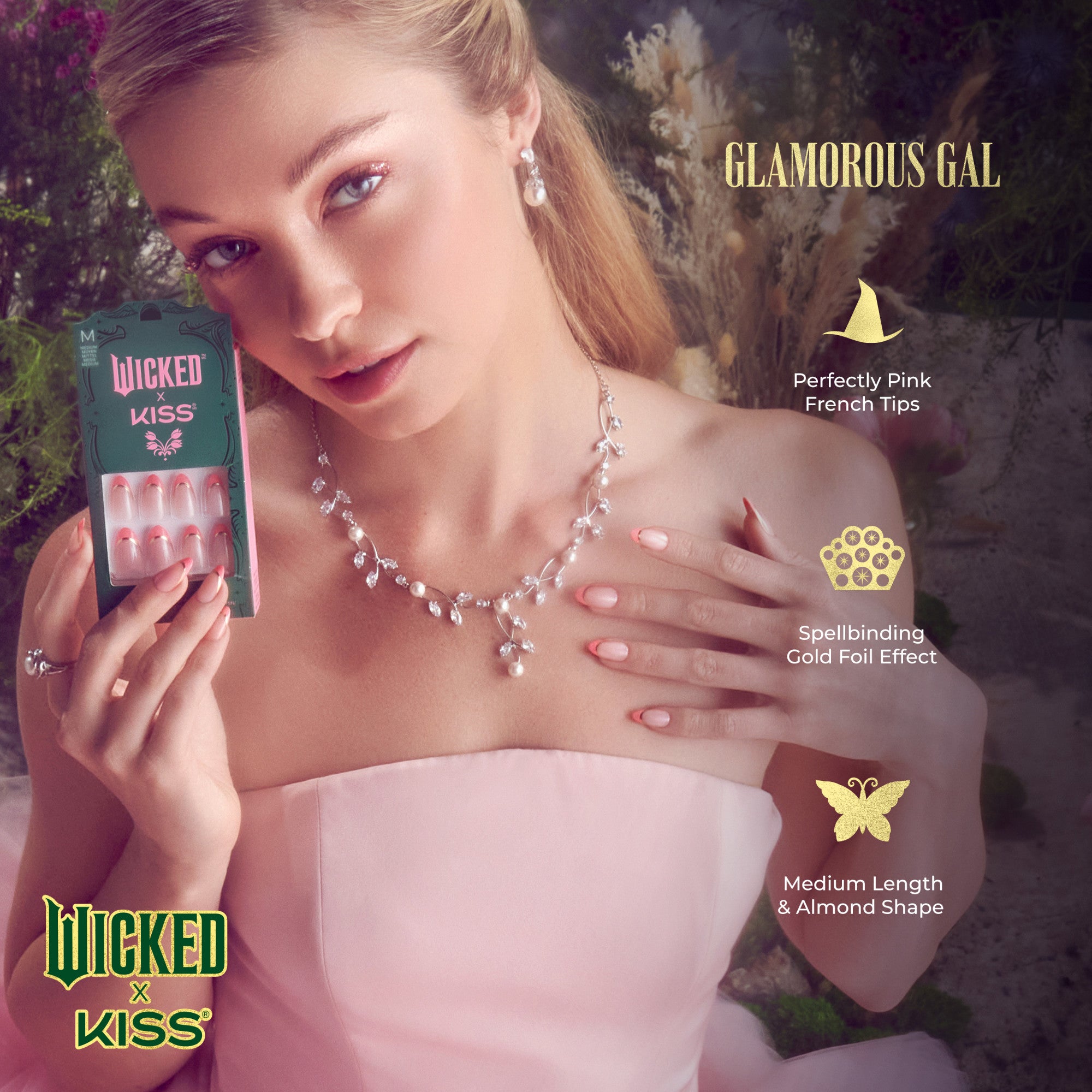 Young woman in a pale pink strapless dress wears a sparkling pearl and crystal necklace and displays medium-length almond-shaped nails with perfectly pink French tips and a gold foil effect, holding a package of Wicked X Kiss Glamorous Gal press-on nails.
